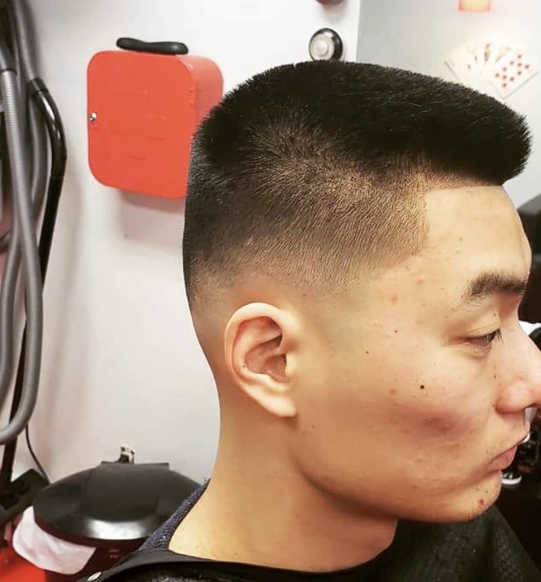 Structured short haircut with a high skin fade